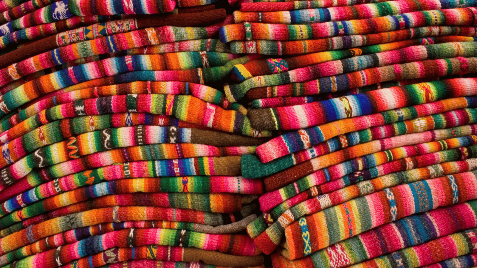 colorful Indigenous fabric stacked on top of each other