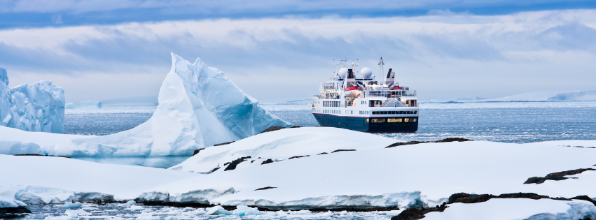 Cruise ship in sailing among ice bergs